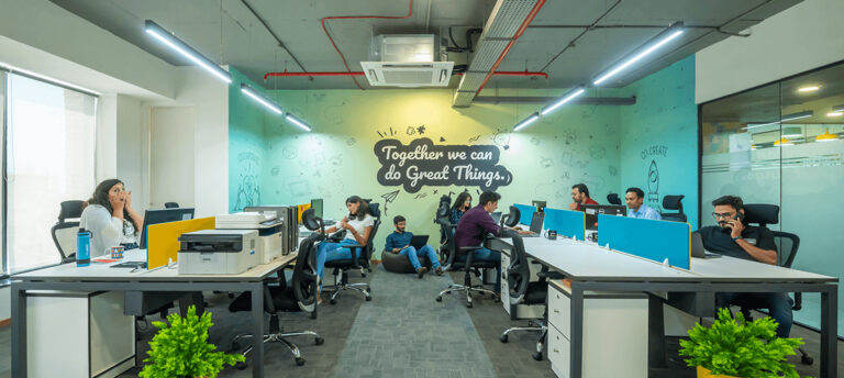 Modern coworking space in Jaipur with team working at shared desks